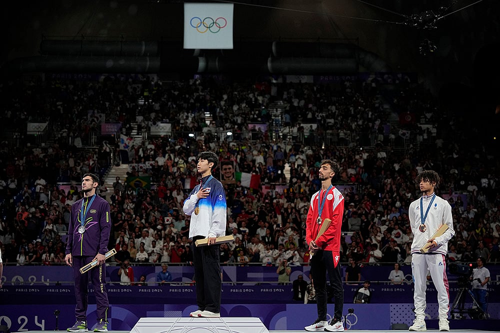 | Photo: AP/Andrew Medichini : Men's 58kg Taekwondo: Azerbaijan's Gashim Magomedov (Silver), Korea's Taejoon Park (Gold), Tunisia's Mohamed Khalil Jendoubi (Bronze) and France's Cyrian Ravet (Bronze) 